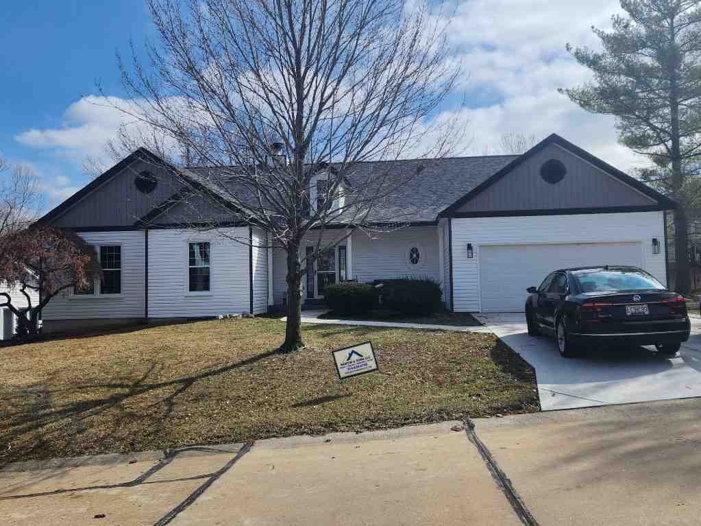 damaged fiber cement siding on St Louis home